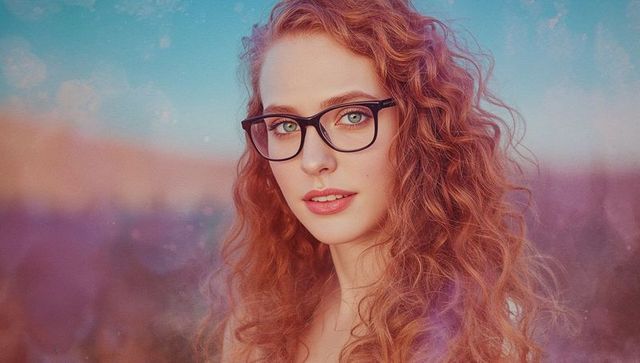 Redhead Woman Embracing Golden Hour Elegance with Glasses