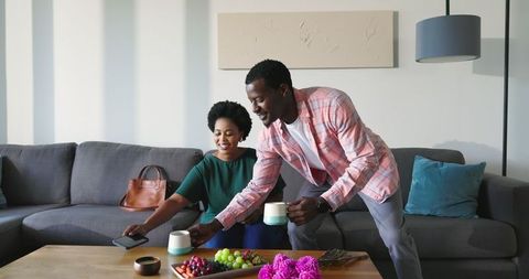 Friends Bonding in Cozy Living Room Over Coffee and Conversation