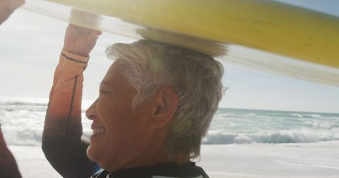 Senior Woman Enjoying Surfing on Sunny Beach Day - Download Free Stock Images Pikwizard.com