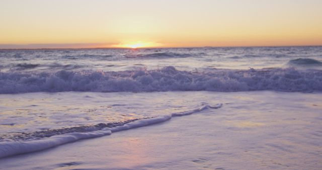 Serene Sunset Over Calm Ocean Waves on Sandy Beach - Download Free Stock Images Pikwizard.com