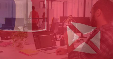 Caucasian Businessman Working on Laptop Featuring Wallis and Futuna Flag Overlay