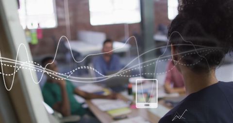 Innovative team collaborating with finance technology overlay