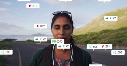 Travel vlogger exploring scenic coastal highway with social media icons