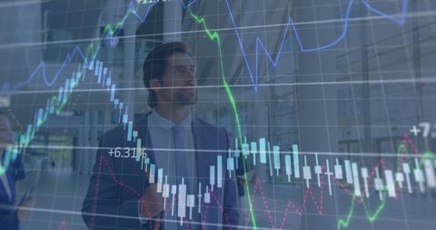 businessman surrounded by digital financial graphs - Download Free Stock Images Pikwizard.com