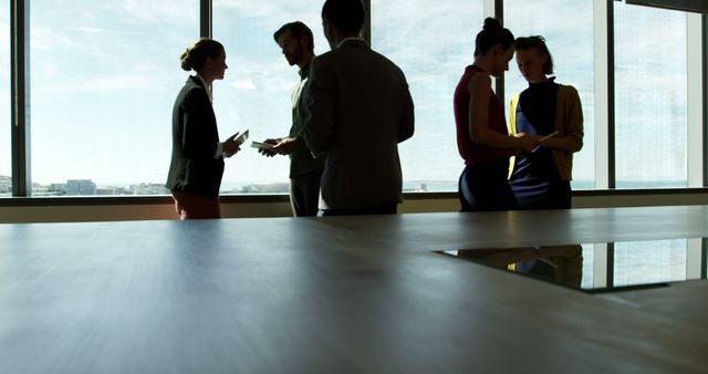 Colleagues Collaborating in Modern Office with Natural Light - Download Free Stock Images Pikwizard.com