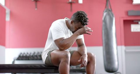 Exhausted gym session rest moment perseverance power