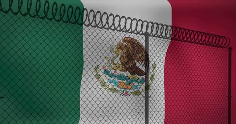 Mexican flag behind razor wire fence symbolizing border security, migration, sovereignty