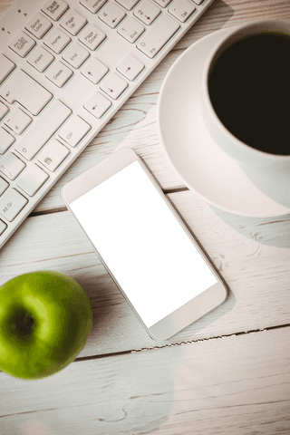 Smartphone screen with transparent mockup background on white table