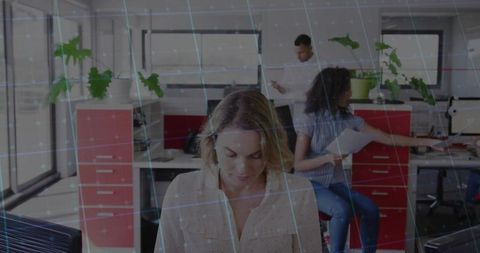 Professional Team Working in Modern Office with Technology Overlay