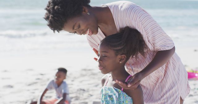 Mother and Daughter Enjoying Day at Beach - Download Free Stock Images Pikwizard.com