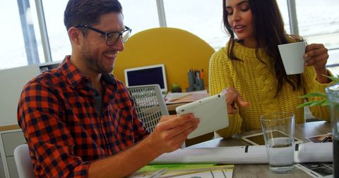 Young Professionals Collaborating in Vibrant Office Environment