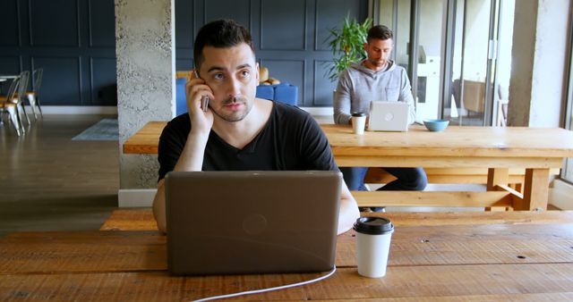 Young Professionals Working on Laptops in Modern Office - Download Free Stock Images Pikwizard.com