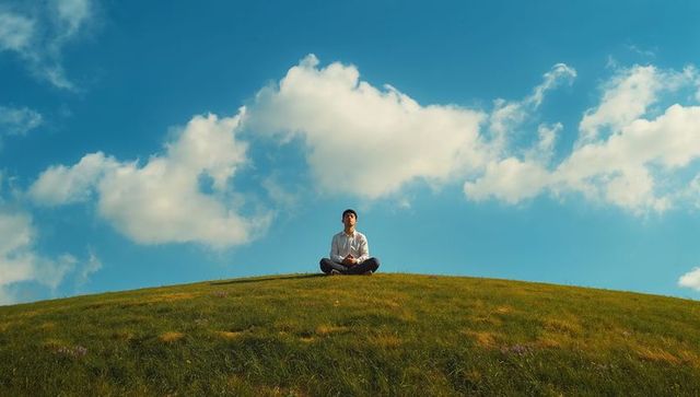Solitary Meditation on Sunny Hilltop Embracing Mindfulness