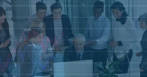 Diverse business team analyzing digital trends in office