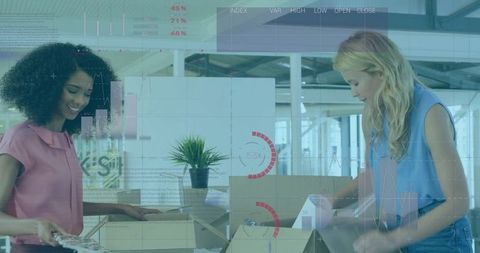 Women Collaborating on Inventory in Warehouse Office