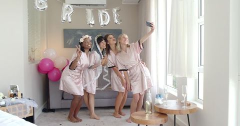 Bride and Friends Celebrating at Hen Party with Joyful Atmosphere