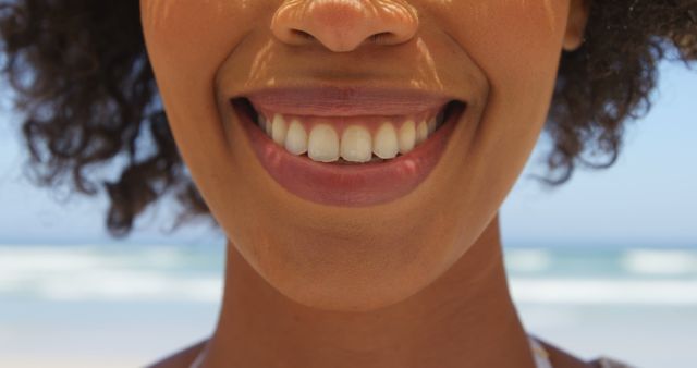 Close-up of Woman Smiling on Beach with Ocean Background - Download Free Stock Images Pikwizard.com