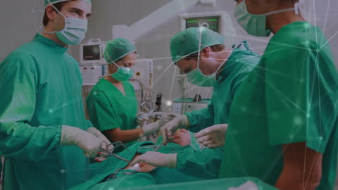 Team of Surgeons Collaborating During an Operation in Hi-Tech Environment