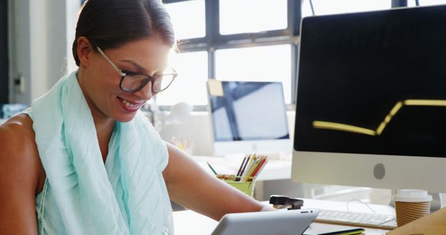 Smiling Professional Businesswoman Working on Digital Tablet at Office Desk - Download Free Stock Images Pikwizard.com