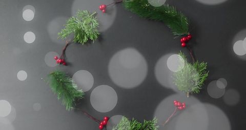 Christmas Wreath with Red Berries and Pine Branches on Dark Bokeh Background - Download Free Stock Images Pikwizard.com