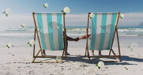 Romantic Couple on Beach Relaxing in Deckchairs