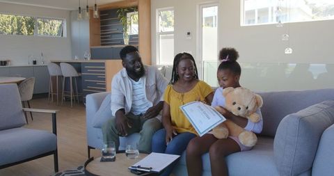 Happy family spending quality time in modern living room