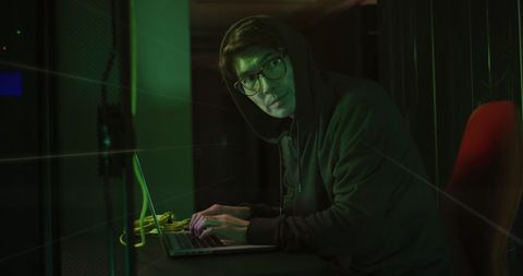 Hacker In Server Room With Laptop - Download Free Stock Images Pikwizard.com