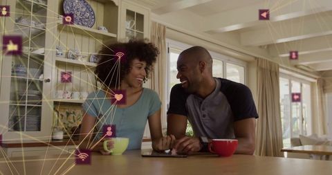 Joyful Couple Enjoying Coffee with Digital Technology and Social Media Icons