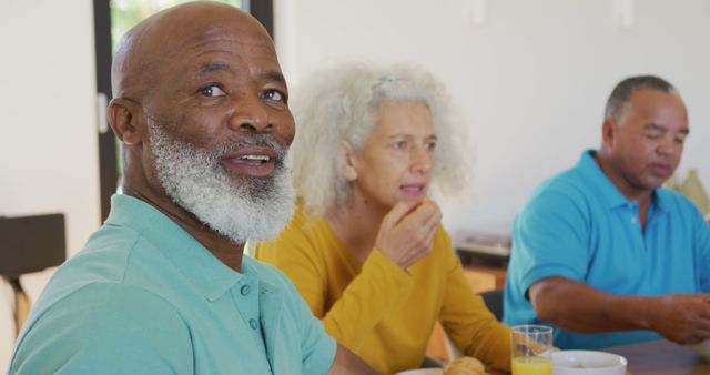 Senior Adults Enjoying Breakfast Together in Bright Modern Kitchen - Download Free Stock Images Pikwizard.com