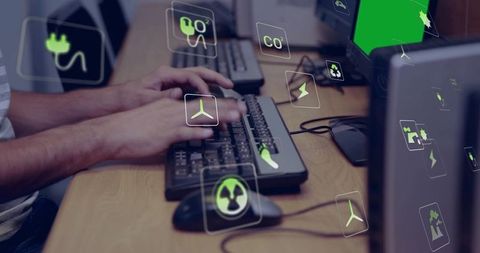 Typing hands on keyboards with green energy icons overlay, sustainable tech collaboration