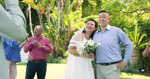 Senior Bride and Groom Celebrate Sunny Garden Wedding with Friends
