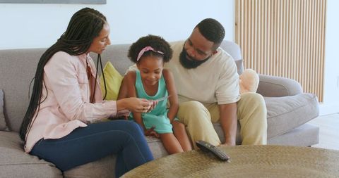 Joyful Family Celebrating Pregnancy Announcement at Home