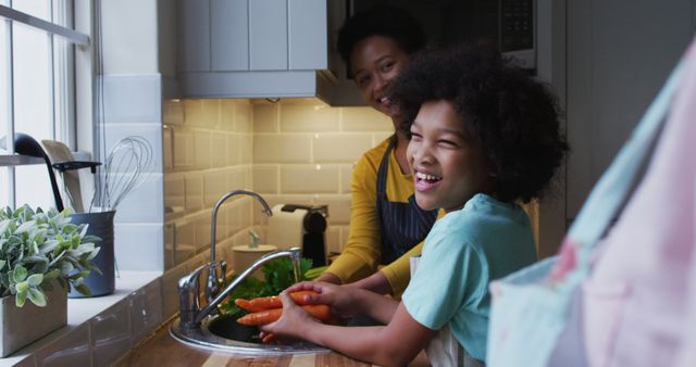 Mother and Son Preparing Vegetables in Kitchen - Download Free Stock Images Pikwizard.com