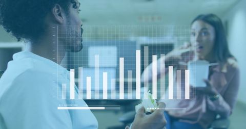 Colleagues Analyzing Data During Office Lunch Break