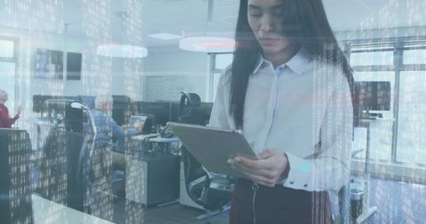 Biracial businesswoman analyzing data technology in office environment