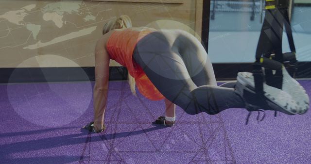 Caucasian Woman Doing Abs Exercise While Integrating Data Technology at Gym - Download Free Stock Images Pikwizard.com