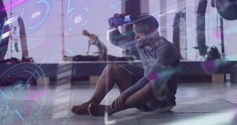 Exhausted Gym Athlete Holding Water Bottle to Brow With Augmented Reality Fitness HUD