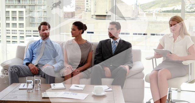 Group of business professionals seated in a modern office setting. Suitable for business, corporate training, teamwork concepts. Ideal for articles, marketing, and presentations focusing on professional settings and collaboration.