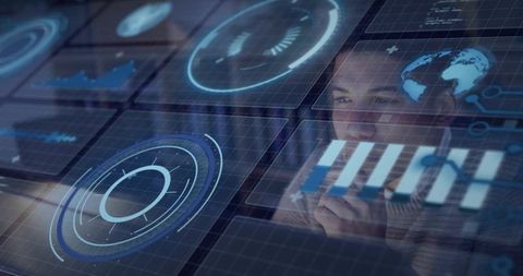 Mid-adult man analyzing holographic data dashboard and futuristic HUD overlays