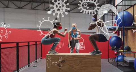 Group fitness squatting on plyo box wearing masks coach guiding plyometric workout