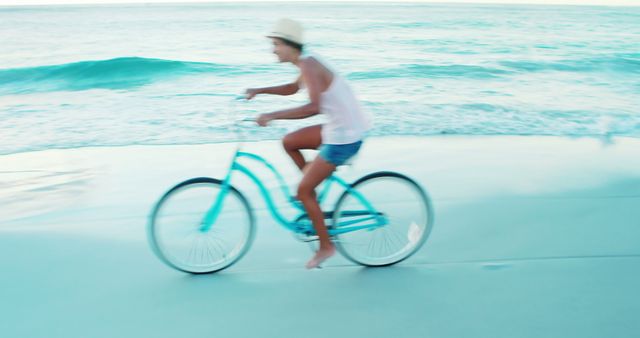 Beautiful woman cycling on the beach on a sunny day 4k