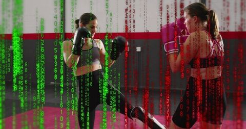 Female kickboxing sparring with digital matrix overlay conveying tech training intensity