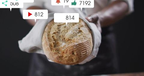 Baker holding artisan sourdough loaf displaying social media engagement overlays