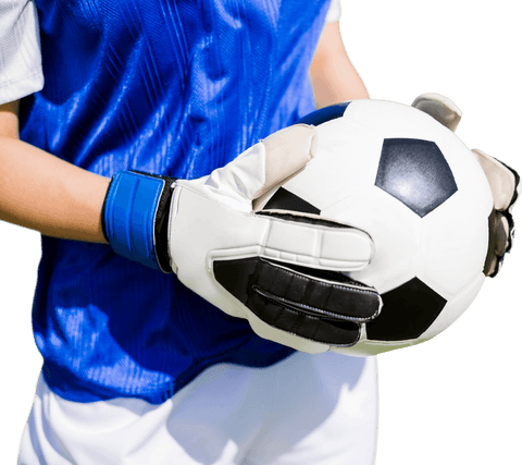Focused goalkeeper holding soccer ball with gloves, transparent background