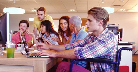 Diverse Group Collaborating in Modern Office Environment