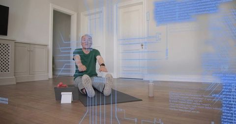 Man stretching on home mat with tablet and dumbbells, futuristic digital fitness overlay