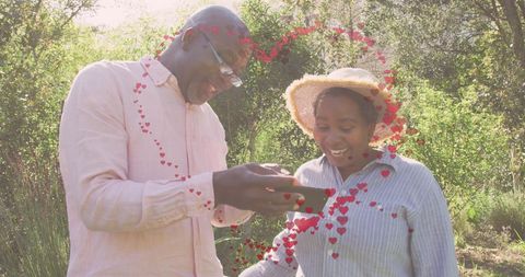 Senior african american couple enjoying christmas with smartphone