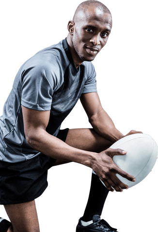 Confident black rugby player holding ball on transparent background