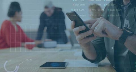 Professionals Using Smartphone and Tablet for Data Analytics Boardroom Collaboration