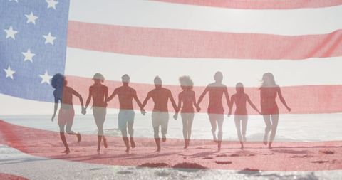 Group of Friends Celebrating with American Flag on Beach